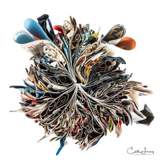 Fine art photograph of folded magazine in the shapes of hearts