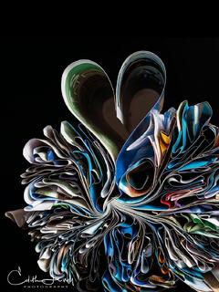 Fine art photograph of folded Seajet Magazine in the shape of hearts
