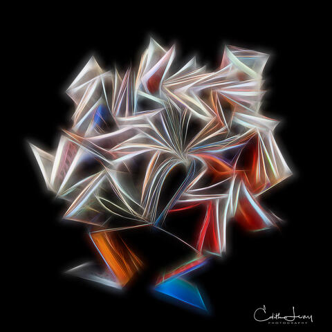 Fine art photograph of folded style at Home Magazine seemingly glowing and floating on a blaze background